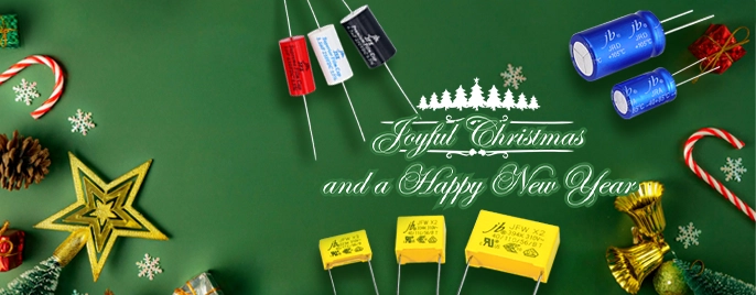 Christmas and New Year themed banner featuring electronic capacitors with festive decorations and holiday greetings