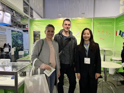 jb Capacitors Company Limited team posing with international visitors at electronica 2024 in Munich, Germany