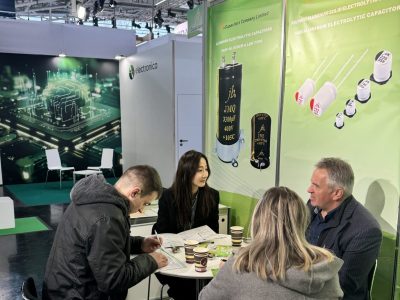 jb Capacitors Company Limited team meeting with international clients at electronica 2024 Munich exhibition booth